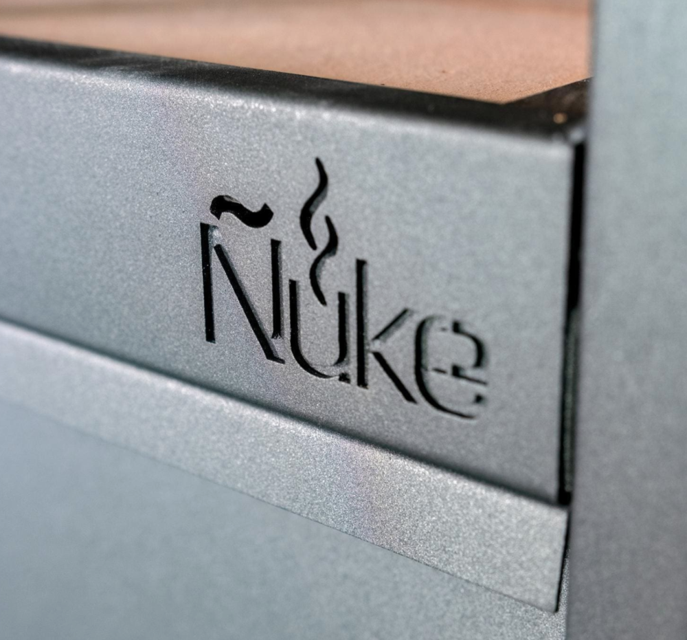 Ñuke® logo stamped into front of grill